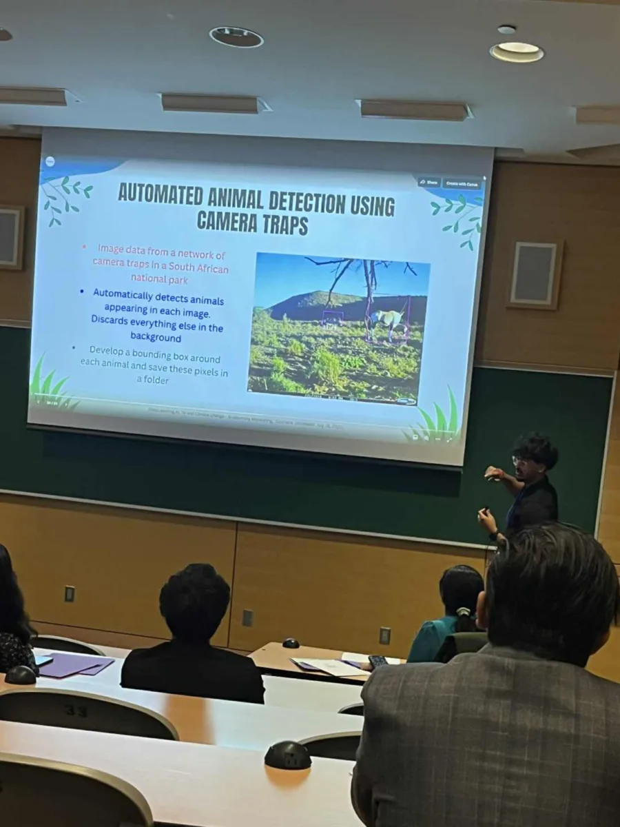 Lance Adhikari presenting a slide about automated animal detection using camera traps