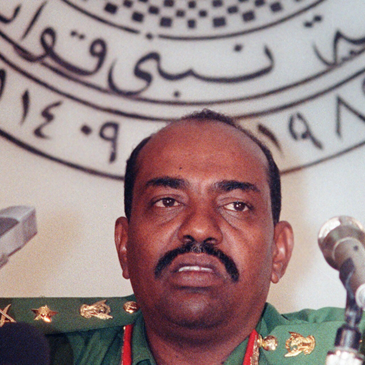 Portrait of Omar al-Bashir in military uniform.